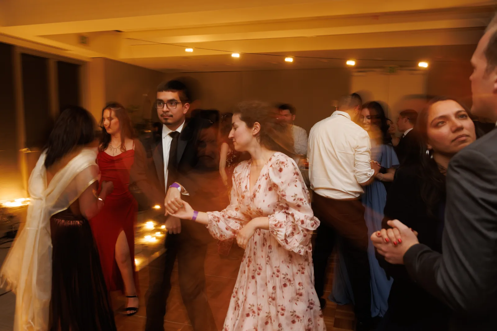 Young adults dancing together at a Bay Wide fellowship celebration